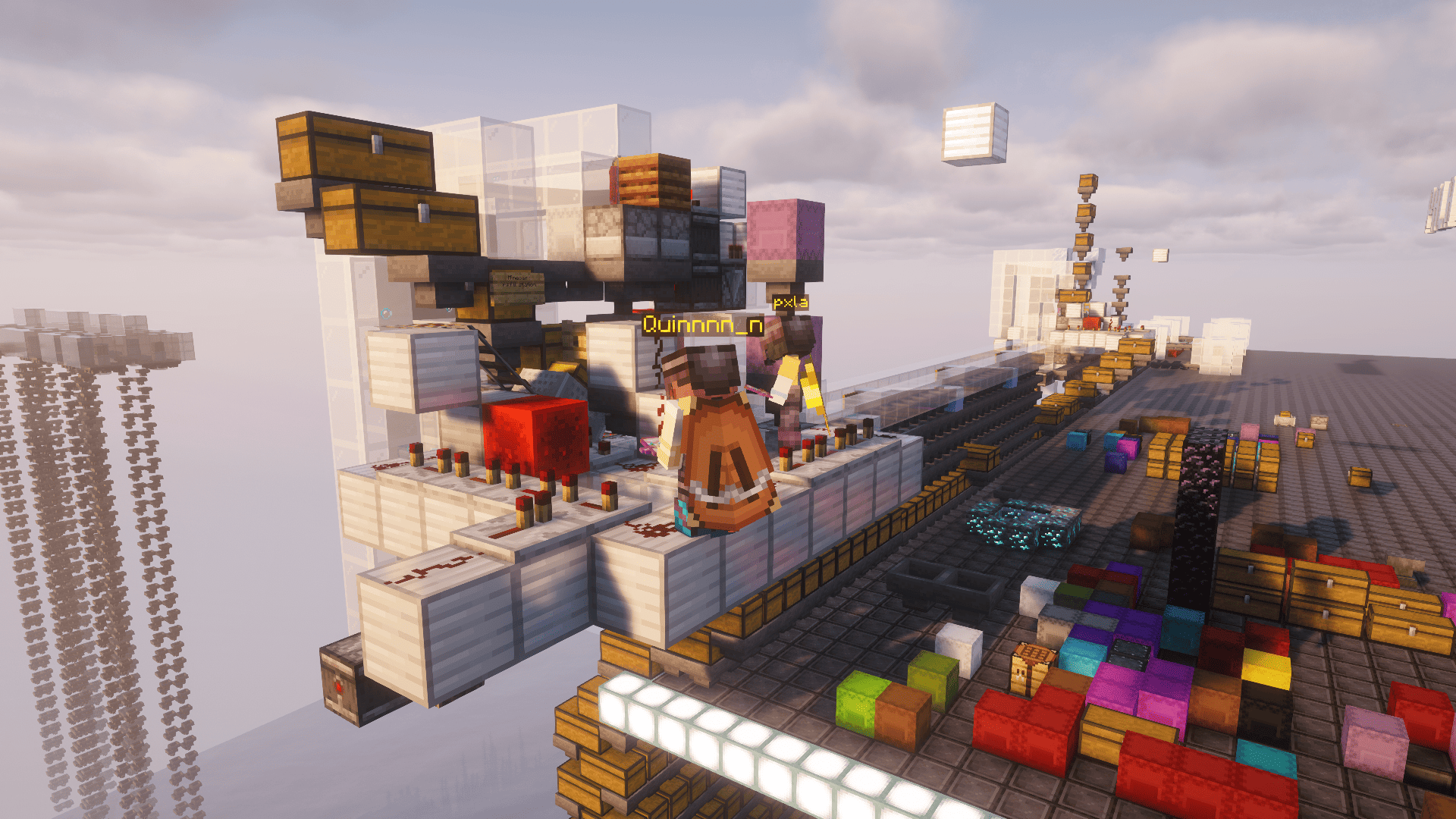 Minecraft players Quinnnn_n and pxla standing beside a redstone dupe machine surrounded by chests and colorful shulker boxes.