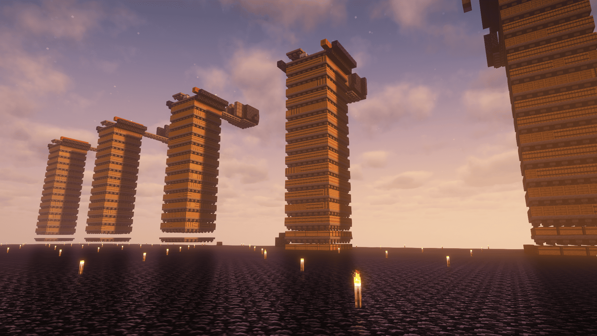 Rows of tall chest storage towers at a 6b6t Minecraft dupe stash under a sunset sky.