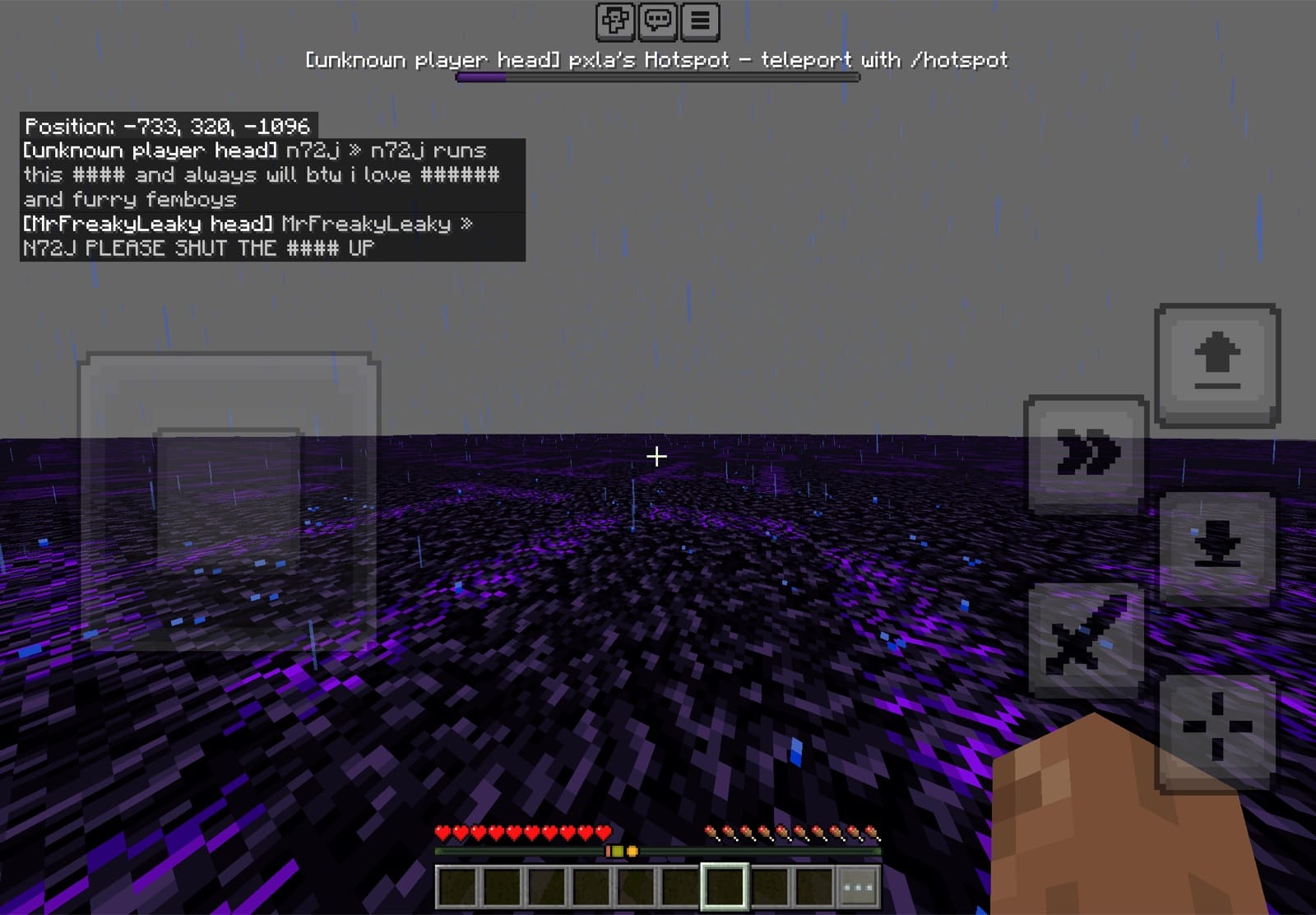 6b6t on Minecraft Bedrock Edition played on a phone, with touch controls and obsidian terrain at a player hotspot