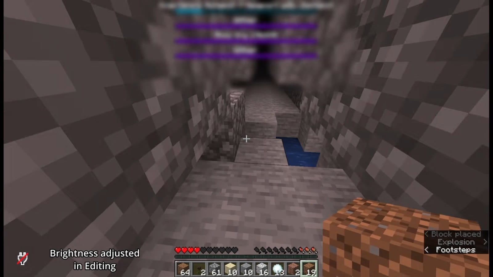 A narrow stone tunnel on 6b6t, dug by earlier players, with water running across its floor.