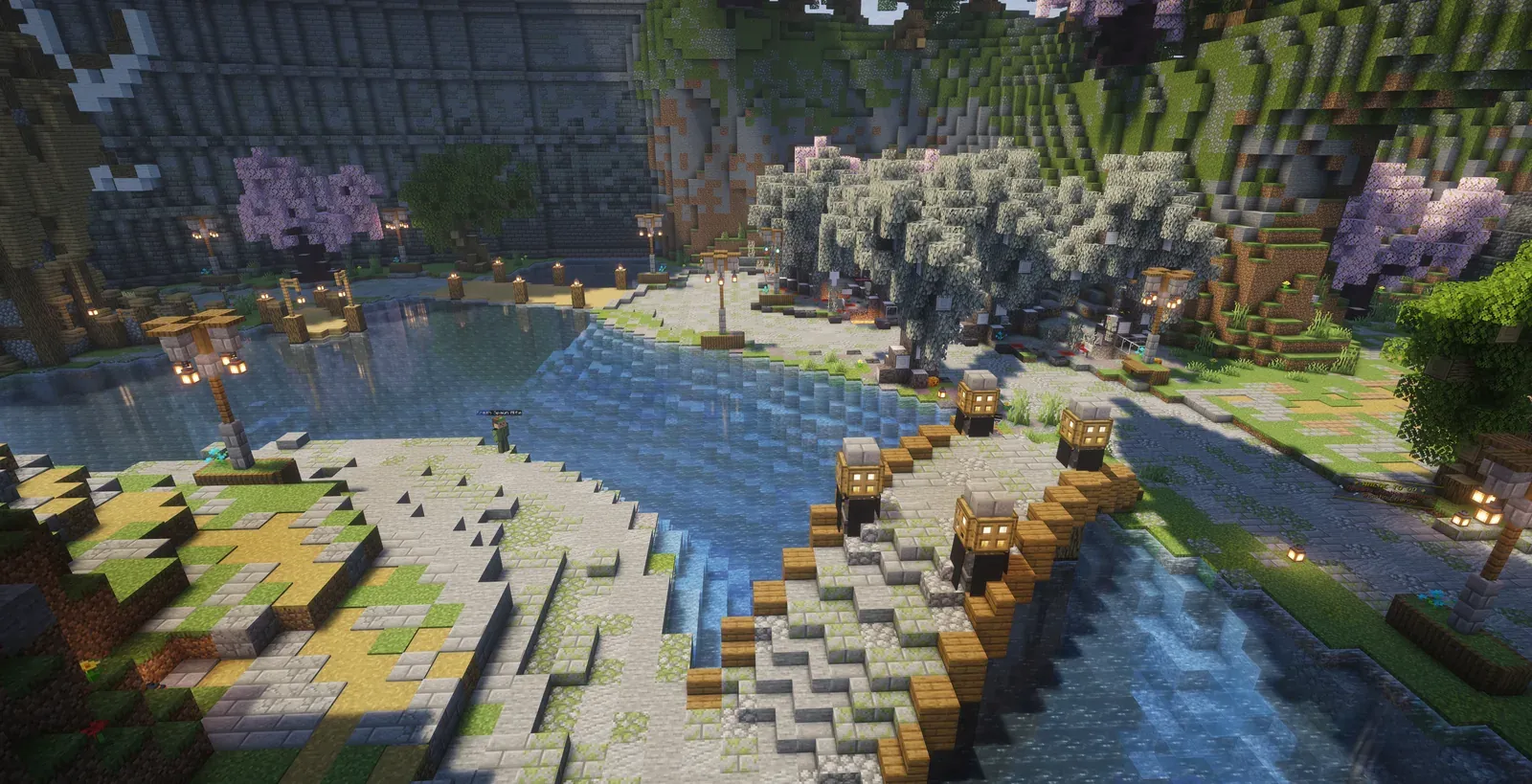 The new 6b6t lobby from above, with a lake, a stone bridge, cherry trees and lanterns along the paths