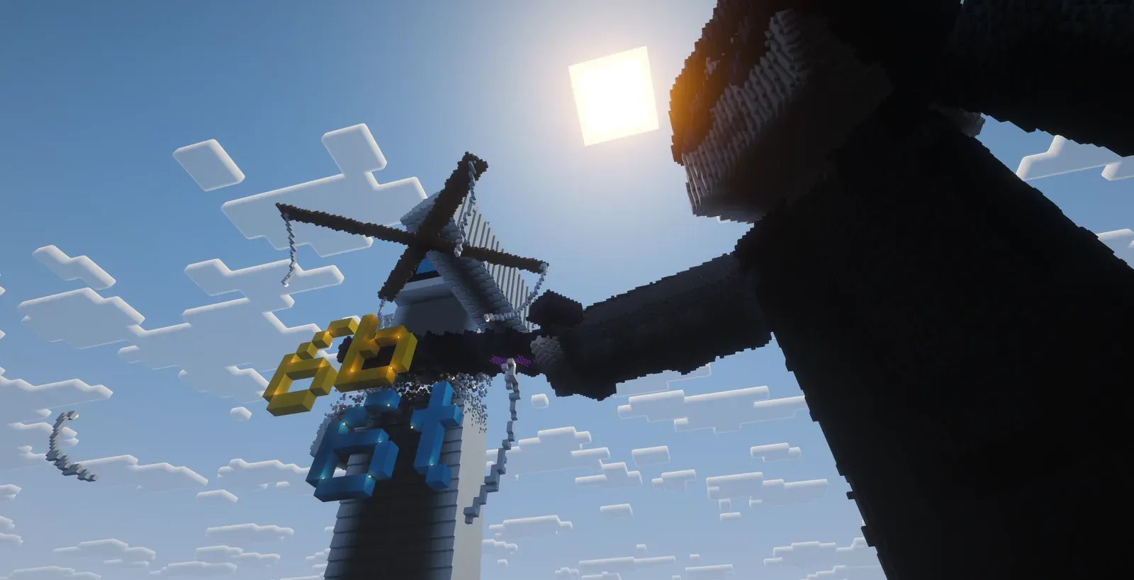 The giant statue of qbasty against the sun, his sword through the Microsoft robot