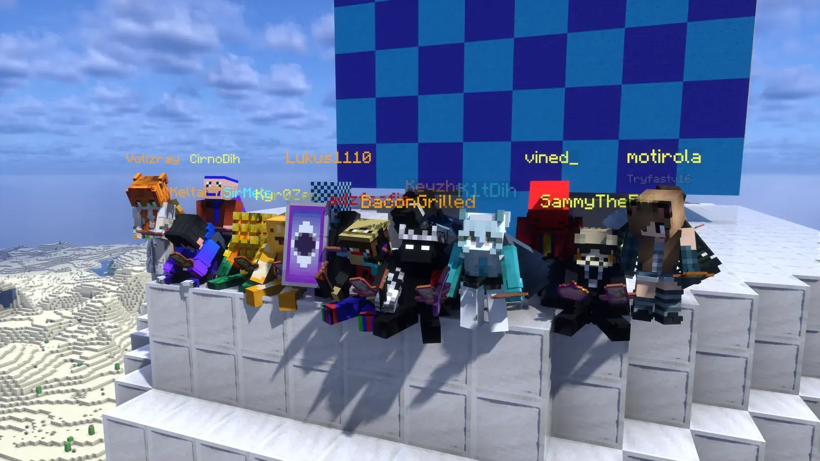 About a dozen 6b6t players sitting on a white wall in front of a blue checkered tower at Orange Oasis on CosmoWorld night 1.