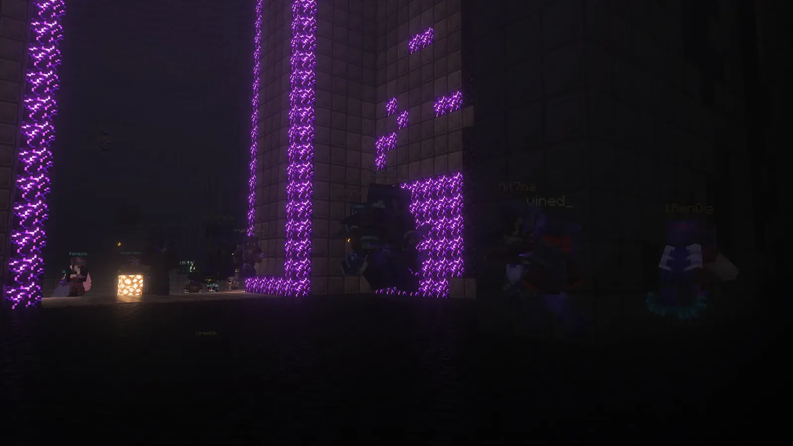 Players in the dark inside the 2026 Halloween maze, between tall stone walls streaked with glowing purple blocks