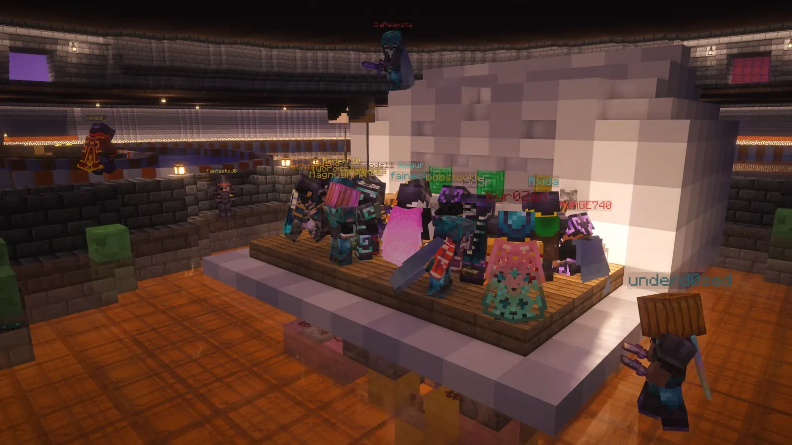 A crowd of players packed around the slot machine on a stage at The Highway Men's 2026 Halloween after party